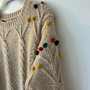 Cozy Beige Sweater with Colorful Accents